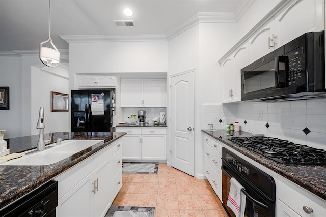 kitchen with visible vents, a sink, ornamental molding, and black appliances