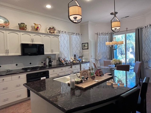 kitchen featuring black appliances, visible vents, white cabinets, and ornamental molding