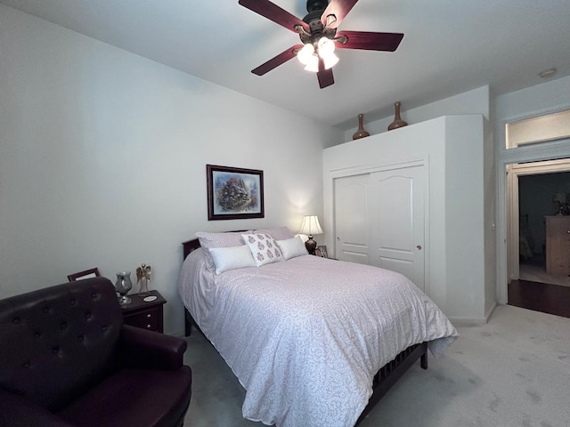 bedroom featuring carpet, a closet, and ceiling fan