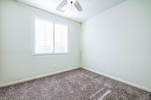 empty room featuring carpet floors, ceiling fan, and baseboards