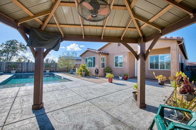 view of swimming pool with a fenced in pool, a patio area, a fenced backyard, and a gazebo