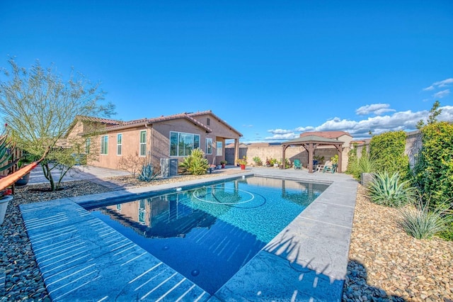 view of pool featuring a fenced backyard, a fenced in pool, a patio, and a gazebo