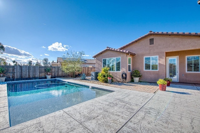 view of pool with a patio, a fenced backyard, a fenced in pool, and central air condition unit