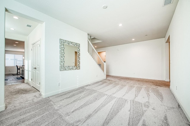 unfurnished room featuring stairs, carpet flooring, visible vents, and recessed lighting