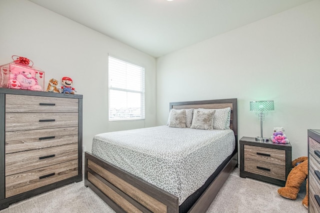 bedroom featuring light colored carpet