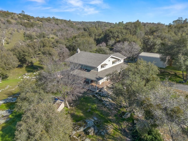 aerial view featuring a view of trees