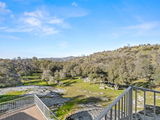 view of mountain feature featuring a forest view