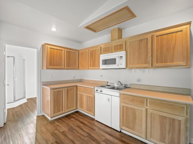 kitchen featuring white microwave, recessed lighting, dark wood-style flooring, a sink, and light countertops