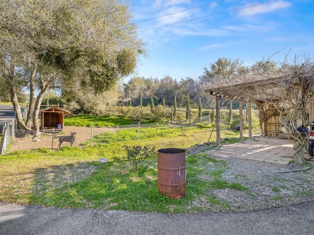 view of yard with fence and a patio