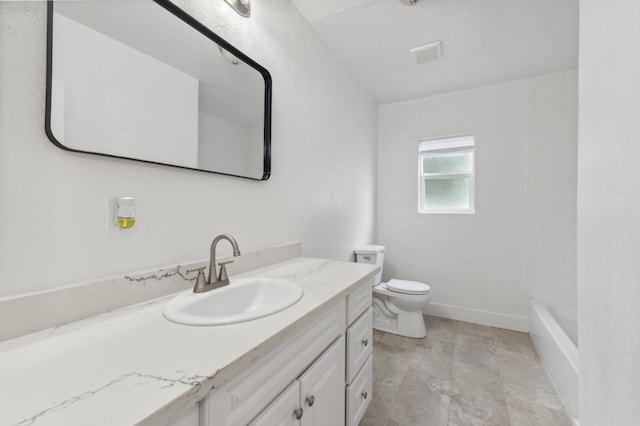 full bathroom featuring vanity, toilet, and baseboards