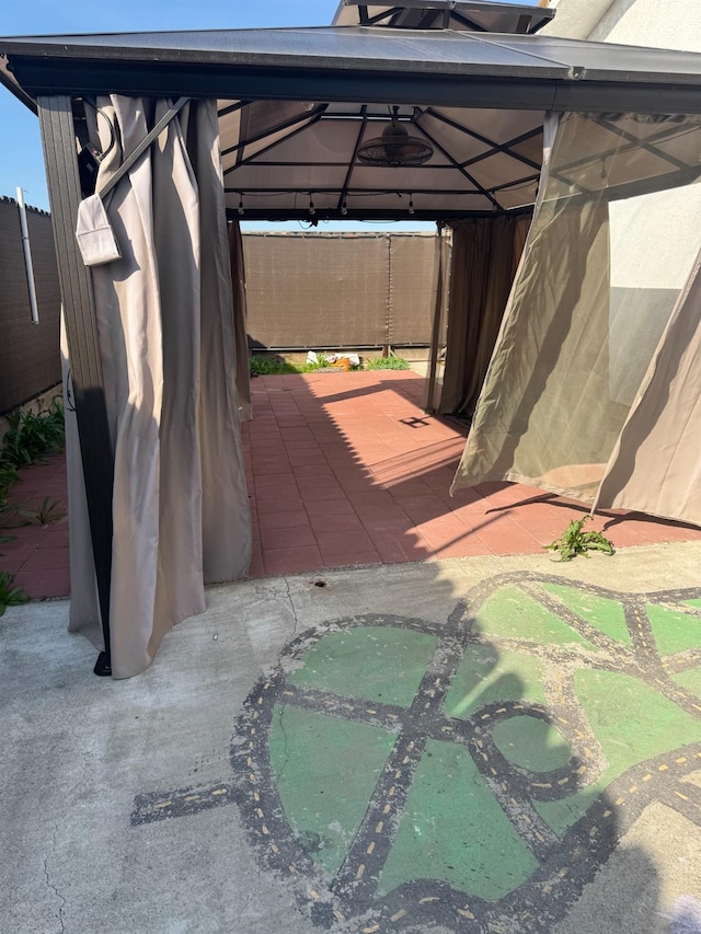 view of vehicle parking with a gazebo