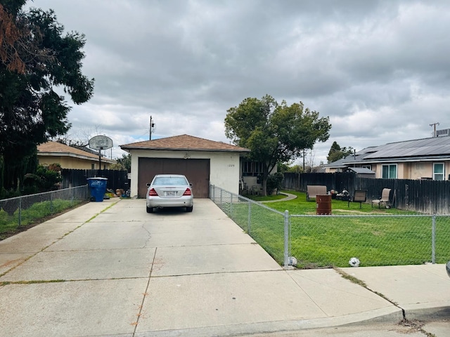 single story home with a fenced front yard, driveway, a front lawn, and stucco siding