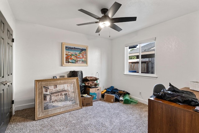 home office with ceiling fan, carpet flooring, and baseboards