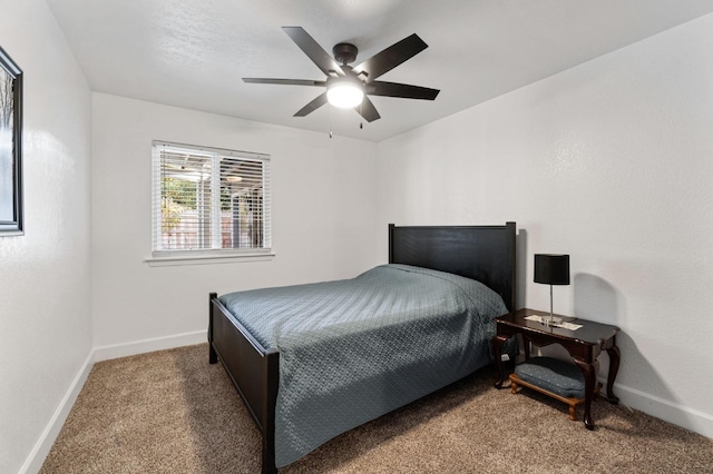 bedroom featuring ceiling fan, carpet flooring, and baseboards