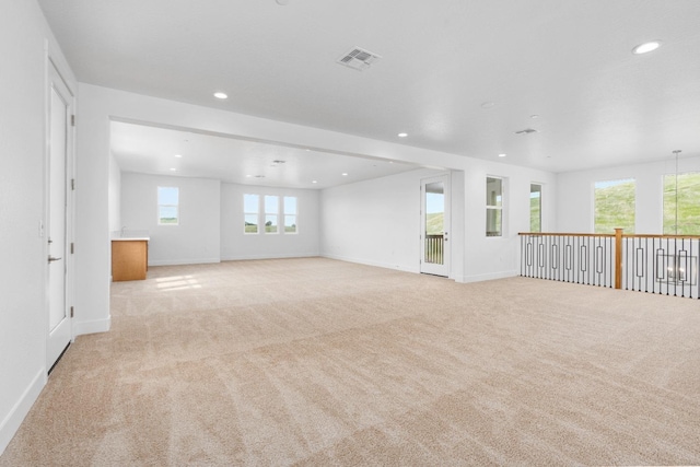 unfurnished room with recessed lighting, visible vents, baseboards, and light colored carpet