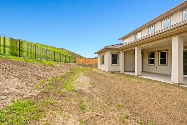 view of yard with a patio area and a fenced backyard