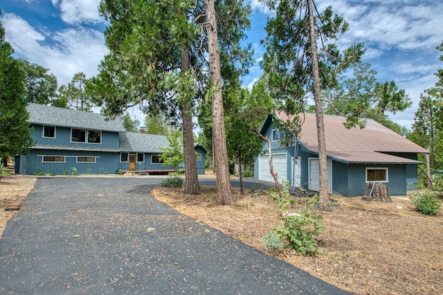 view of front of house featuring driveway and a garage