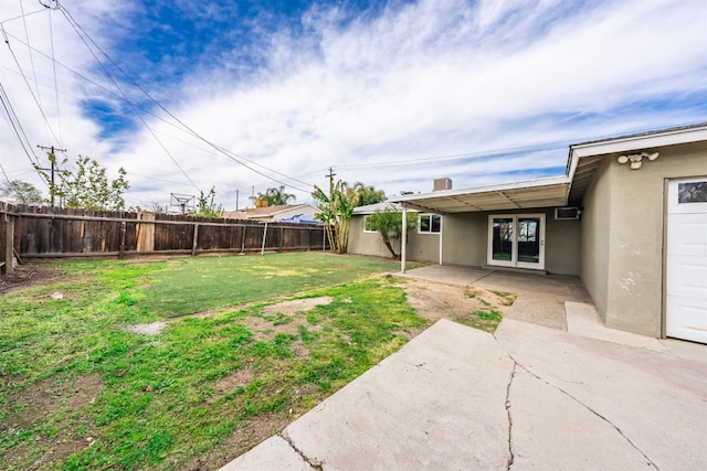 view of yard with a patio area and a fenced backyard