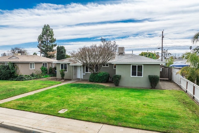 ranch-style home featuring stucco siding, cooling unit, a front yard, and fence