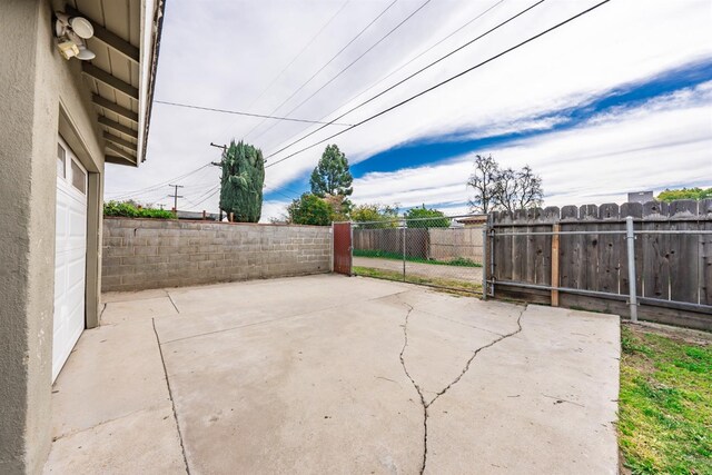 view of patio / terrace featuring fence