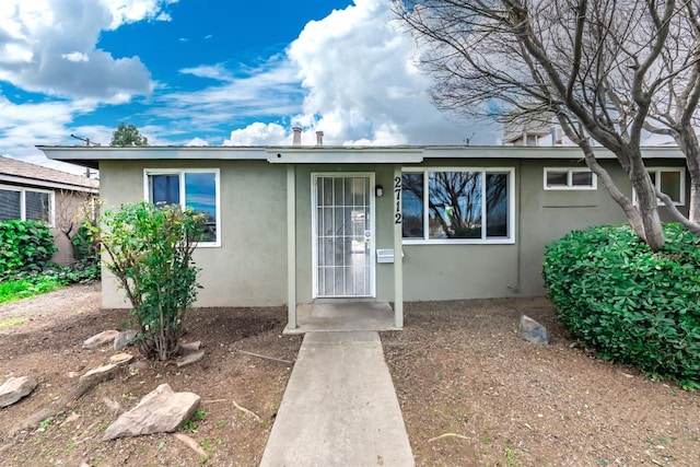 view of front of home featuring stucco siding