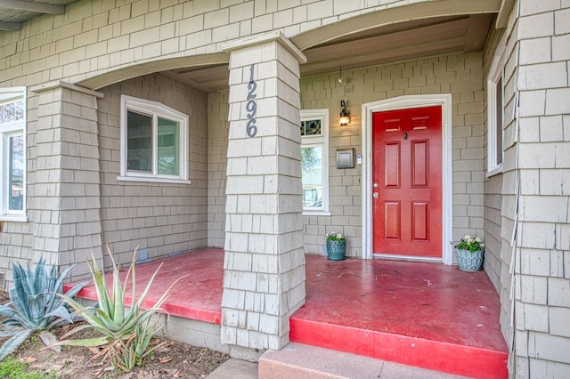 property entrance featuring covered porch