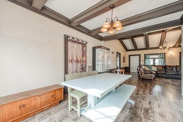 game room featuring vaulted ceiling with beams, hardwood / wood-style flooring, and a chandelier