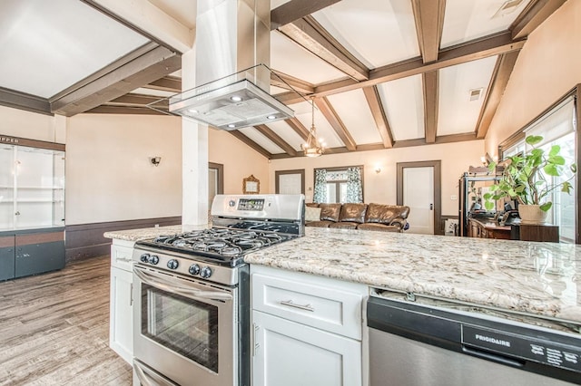 kitchen featuring vaulted ceiling with beams, stainless steel appliances, visible vents, island range hood, and light wood-type flooring