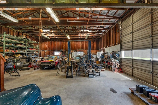 garage with metal wall and a workshop area