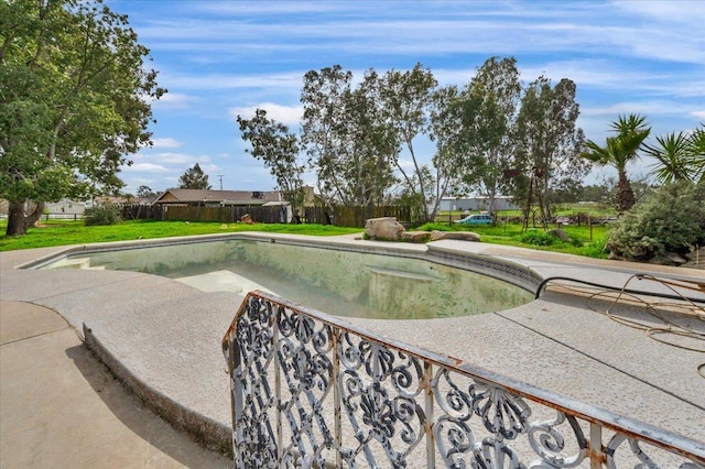 view of swimming pool featuring a patio, a lawn, a fenced backyard, and a fenced in pool