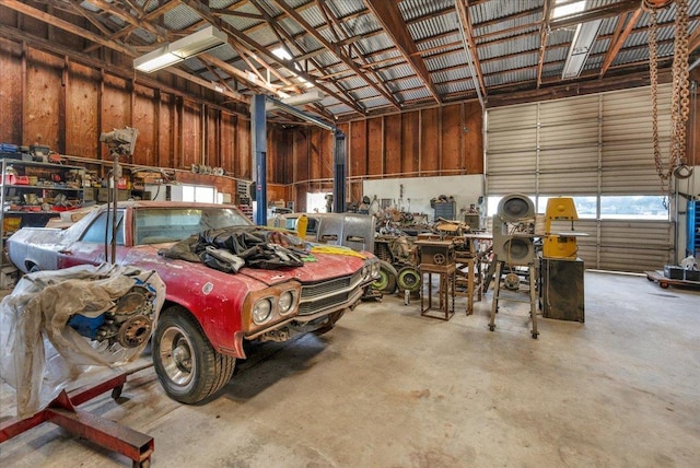 garage featuring a workshop area and metal wall