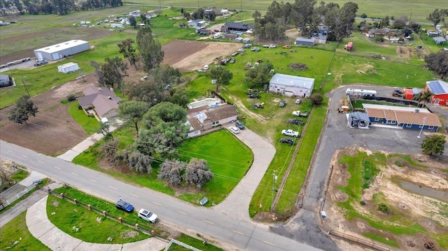 birds eye view of property with a rural view