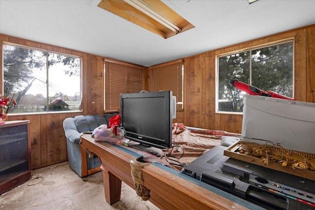 office space featuring wood walls