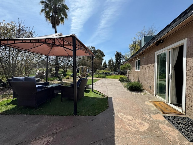 view of patio / terrace with a gazebo and an outdoor living space