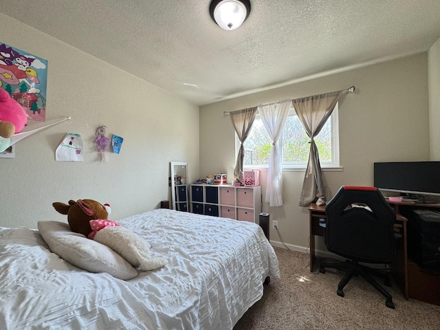 carpeted bedroom with baseboards and a textured ceiling