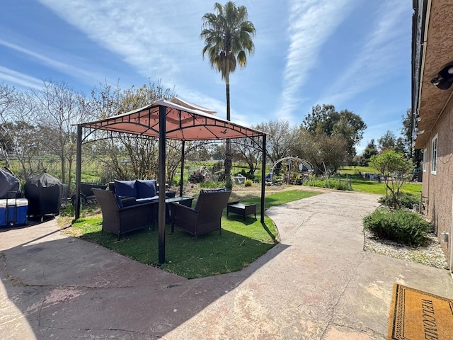 view of patio / terrace featuring outdoor lounge area, a gazebo, and area for grilling