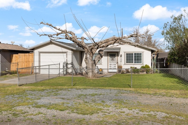 view of front of property with a fenced front yard, driveway, a front lawn, and stucco siding