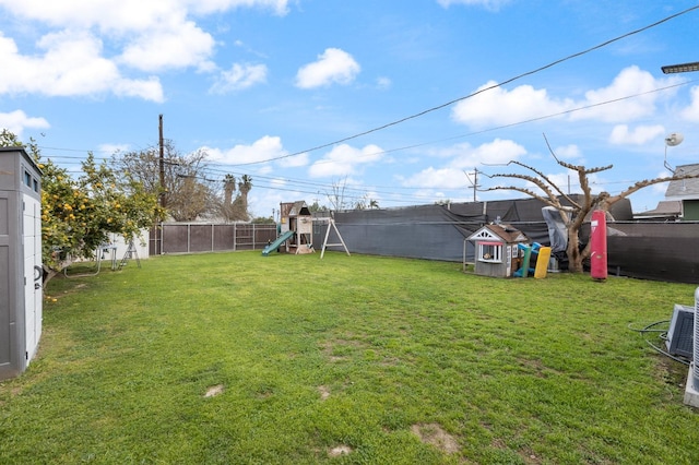 view of yard featuring a playground and a fenced backyard