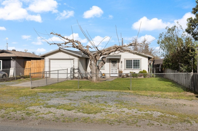 view of front of home with driveway, a garage, a fenced front yard, a front lawn, and stucco siding