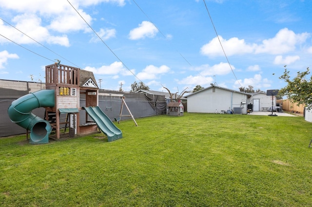 view of jungle gym with fence and a lawn