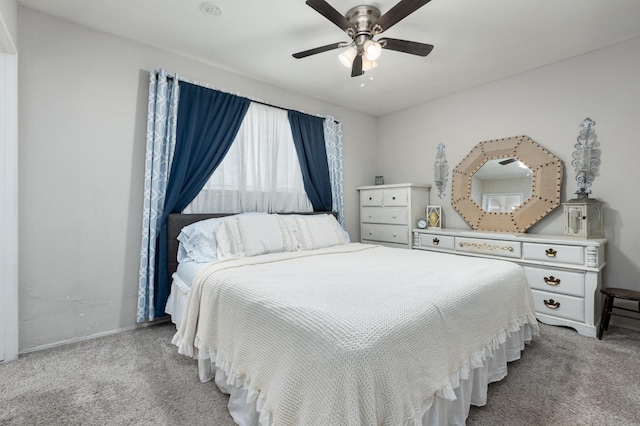 bedroom with ceiling fan and carpet