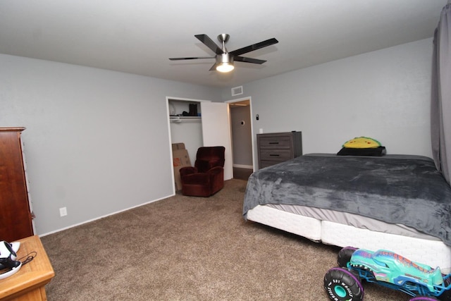carpeted bedroom with a ceiling fan, a closet, and visible vents