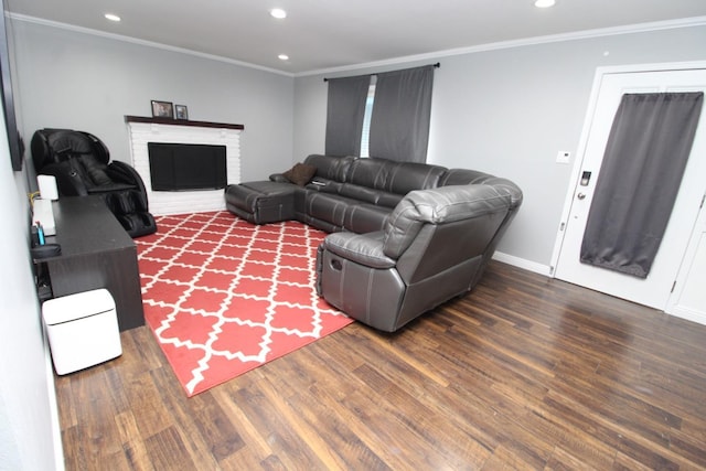 living area featuring a fireplace, recessed lighting, ornamental molding, wood finished floors, and baseboards