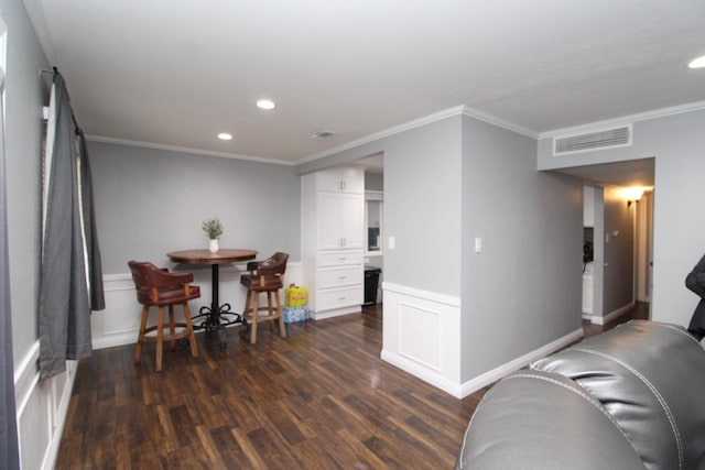 interior space with visible vents, white cabinets, dark wood-style flooring, crown molding, and recessed lighting