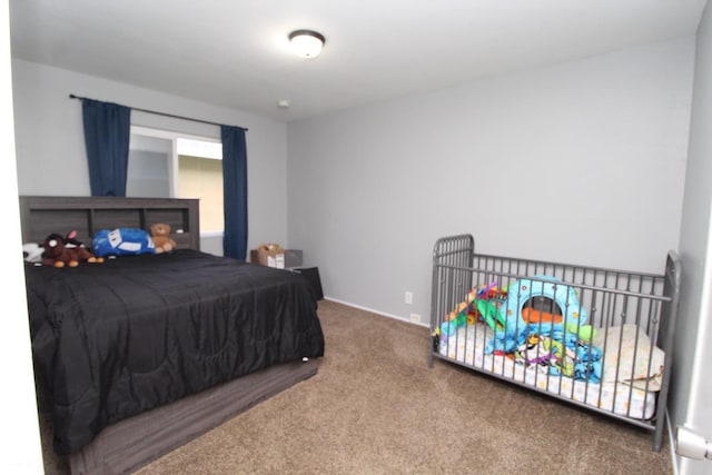 bedroom with baseboards and carpet flooring