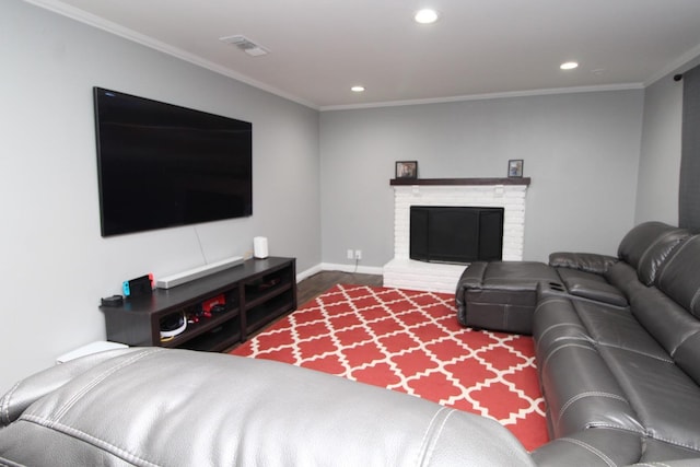 living room with crown molding, recessed lighting, visible vents, and wood finished floors