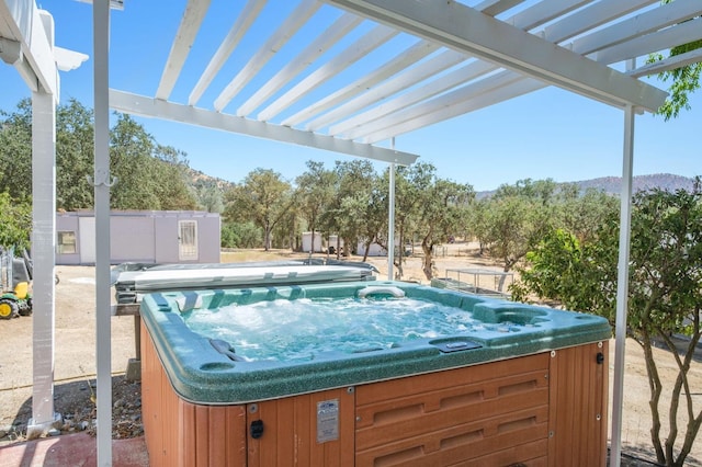 view of pool with a pergola