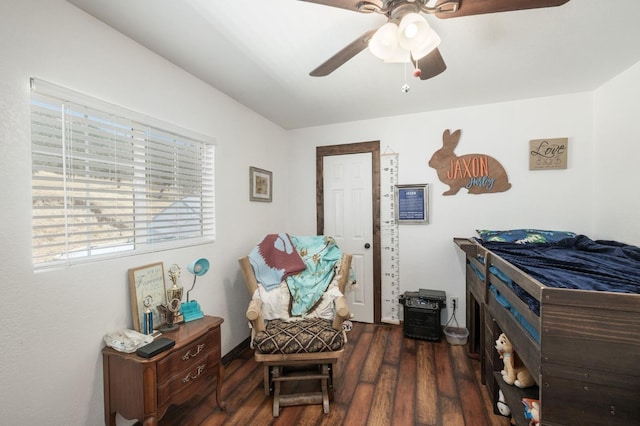 sitting room featuring wood finished floors and a ceiling fan