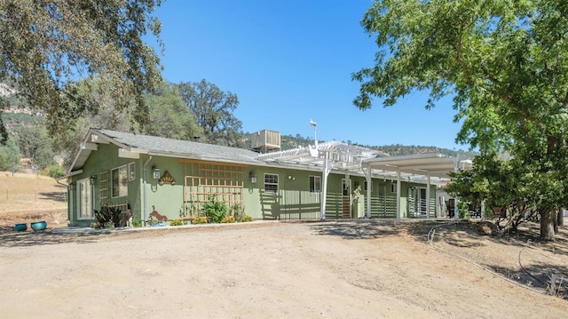 view of front of house featuring stucco siding