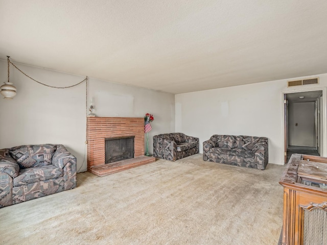 carpeted living area featuring a brick fireplace, visible vents, and a textured ceiling